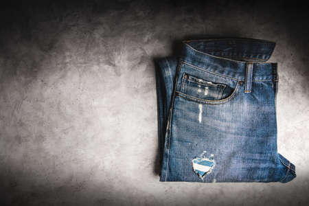 Jeans Pant lay on Cement Floor. Fashion, Clothes for any Gender, Classic Wearing for Diversity. Top...