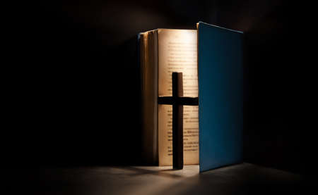 Spirituality, Religion and Hope Concept. Holy Bible and Cross on Desk. Symbol of Humility, Supplication,Believe and Faith for Christian Peopleの写真素材