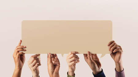 Peaceful, Human Rights and Freedom to Speak and Expression. Group of People Raised up a Blank Speech Bubble Cardの写真素材