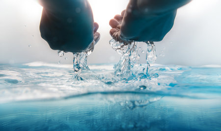 Hand Scooping and Pouring Water. Freshness and Clear. World Water Day Concept. Environmental Care...