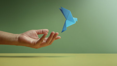 Peace, Hope concepts. World International Peace Day. Sustainable and Responsible Business, Hand Released a Paper Origami Doveの写真素材