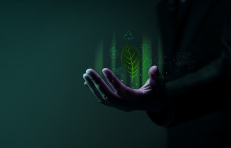 Green Energy, Renewable and Sustainable Resources in Environmental Concept. Holding a Leaf and many...