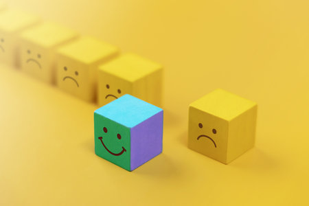 Different, Talent and Outstanding Concept. a Unique Smiling Cube that Stand Out among Crowdの写真素材