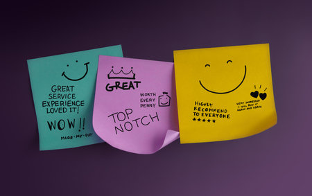 Customer feedback notes with smiley faces and handwritten compliments reflect positive reviews and satisfaction in service experienceの写真素材