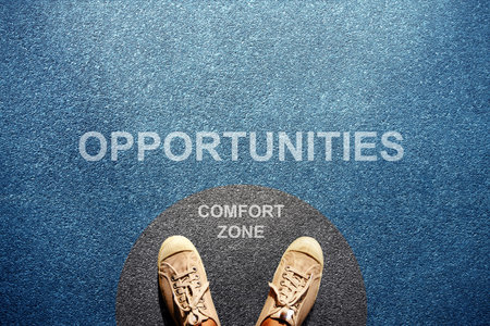 Comfort Zone Concept. Male on Sneaker Shoes Standing on Circle Concrete Floor, Ready or Start to Steps outside for New Opportunities. High angle View. POV viewの写真素材