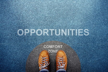 Comfort Zone Concept. Male on Circle Line Concrete Floor, Ready or Start to Steps outside for New Opportuniyies. High angle View. POV viewの写真素材