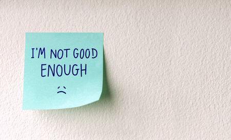 Mind, Mental Health and Self Talk Concepts. a Sticky Note with the Negative Word, Fixed Mindset, Stressed, Anxietyの写真素材