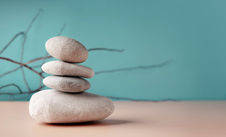 Stacked stones in perfect balance, symbolizing meditation, patience, and harmony in Zen philosophy and mindfulness practiceの写真素材