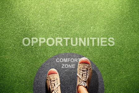 Comfort Zone Concept. Male on Sneaker Shoes Steps out from Circle line, Ready or Start to Steps outside for New Opportunities. High angle View. POV viewの写真素材