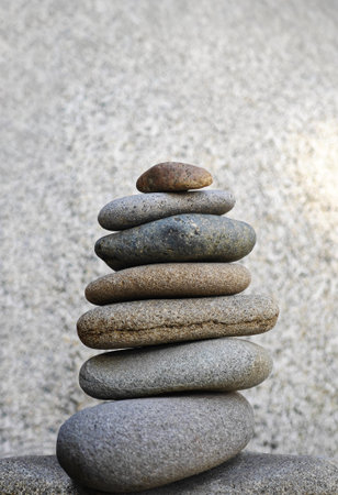 Stacked stones in perfect balance, symbolizing meditation, patience, and harmony in Zen philosophy and mindfulness practiceの写真素材
