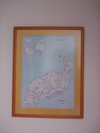 map on the wall of a room with wooden frameの写真素材