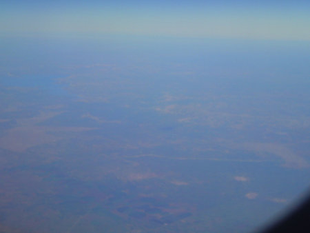 Aerial view of the blue sky and clouds from airplane window.の写真素材