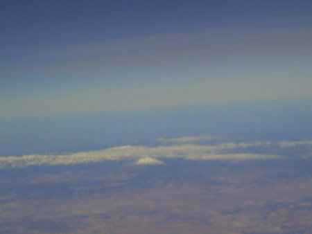 Blue sky and white clouds in the evening. View from airplane window.の写真素材