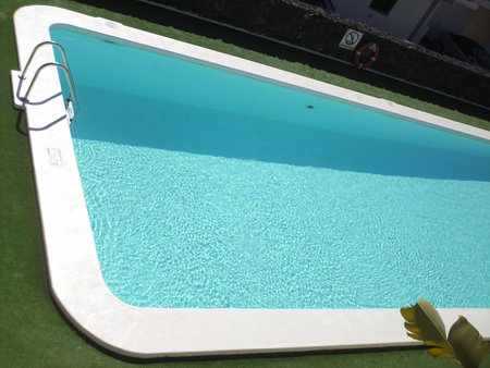 Swimming pool in a hotel, close up of a swimming poolの写真素材