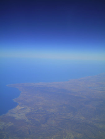 Aerial view of a coastline with blue sky in the backgroundの写真素材