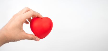 Red heart in hand healthcare concept for World Health Day or Valentine day.の写真素材