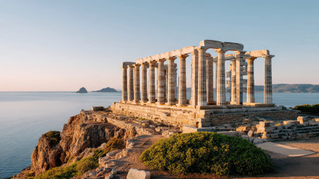 Explore the majestic ruins of an ancient Greek temple standing proudly against a serene ocean backdrop, capturing the beauty of history and nature.の素材
