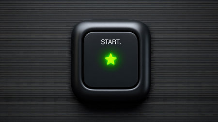A glowing green start button set against a dark textured background. This modern design features a clear label and star icon, symbolizing activation and innovation.の素材