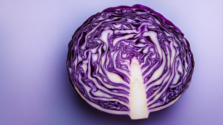 This vibrant halved purple cabbage showcases intricate patterns and textures, highlighting its fresh and nutritious qualities for culinary uses and healthy meals.の素材