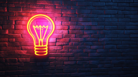 A captivating neon light bulb shines brightly against a dark brick wall, creating a striking visual. This image enhances a modern decor theme, perfect for inspiring creative spaces.の素材