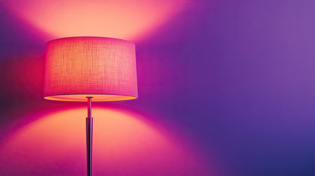A stylish modern lamp emits a vibrant glow in purple hues, creating a cozy and elegant atmosphere perfect for contemporary interior design.の素材