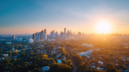 Stunning sunset over an urban skyline showcasing the blend of city life and nature. The vibrant colors and soft light create a peaceful atmosphere perfect for travel and photography.の素材