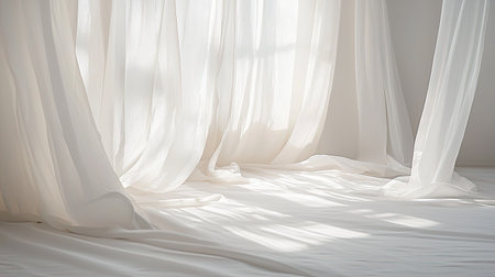 Soft white curtains flow gently in a bright sunlit room, creating a serene and tranquil atmosphere. The light filters through, adding warmth and elegance.の素材