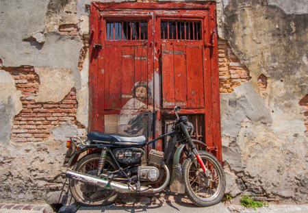 Georgetown, Malesia - the main Island of Malesia, Penang is famous for its street art. Here in particular one of the many paintings of Georgetownのeditorial素材