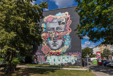 Berlin, Germany - street art and paintings are one of the most prominent landmarks in Berlin. Here in particular a fine example of the city's wall paintingのeditorial素材