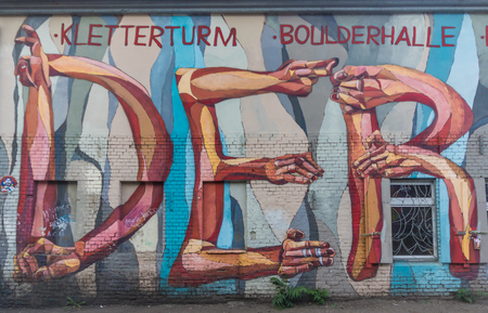 Berlin, Germany - street art and paintings are one of the most prominent landmarks in Berlin. Here in particular a fine example of the city's wall paintingのeditorial素材