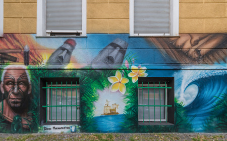 Berlin, Germany - street art and paintings are one of the most prominent landmarks in Berlin. Here in particular a fine example of the city's wall paintingのeditorial素材