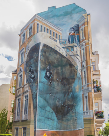 Berlin, Germany - street art and paintings are one of the most prominent landmarks in Berlin. Here in particular a fine example of the city's wall paintingのeditorial素材