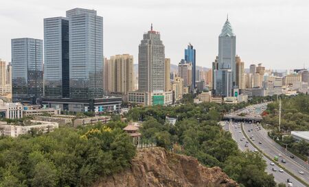 Urumqi, China - capital of the Xinjiang Uygur Autonomous Region, Urumqi displays several wonderful landmarks. Here in particular the city's skylineのeditorial素材