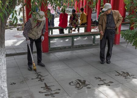 Urumqi, China - capital of the Xinjiang Uygur Autonomous Region, Urumqi is home of the colorful Uyghur ethnic group. Here in particular an everyday life scene in the People's Parkのeditorial素材
