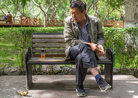 Urumqi, China - capital of the Xinjiang Uygur Autonomous Region, Urumqi is home of the colorful Uyghur ethnic group. Here in particular an everyday life scene in the People's Parkのeditorial素材
