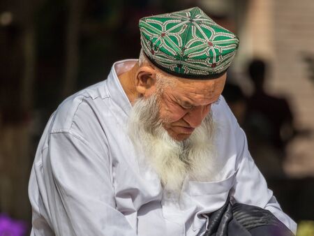 Kashgar, China - almost 85% of Kashgar inhabitants are Uyghurs, a minority Turkic ethnic group culturally affiliated with Central Asia populations. Here in particular an example of Kashgar Uyghursのeditorial素材