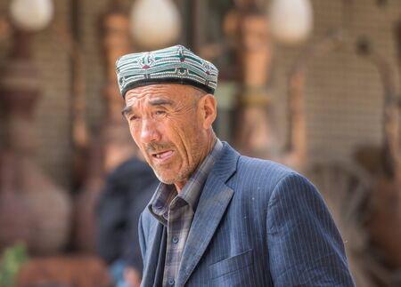 Kashgar, China - almost 85% of Kashgar inhabitants are Uyghurs, a minority Turkic ethnic group culturally affiliated with Central Asia populations. Here in particular an example of Kashgar Uyghursのeditorial素材