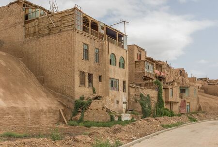 Kashgar, China - even if almost totally demolished in favor of the "new" Old Town, more safe, clean and less chaotic, in Kashgar is still possible to spot few remaining buildings of the original Old Townの写真素材