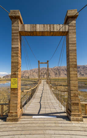 Tashkurgan, China - located 3,500m above the sea level, and last city before the border with Pakistan, Tashkurgan is slowly becoming a tourist attraction with people coming from all over China. Here in particular some footboards to help people visiting thのeditorial素材