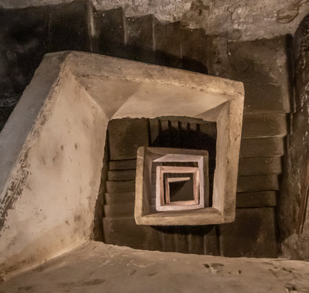 Naples, Italy - built more than 2500 years ago, and widely used during World War II, the Naples subterranean system is a main turist attraction today. Here in particular the staircaseのeditorial素材