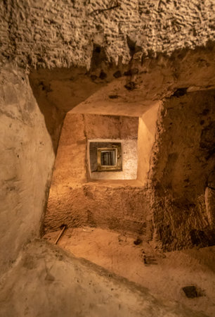 Naples, Italy - built more than 2500 years ago, and widely used during World War II, the Naples subterranean system is a main turist attraction today. Here in particular the staircaseのeditorial素材