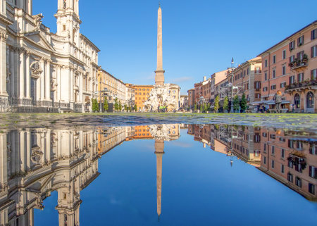 Rome, Italy - in Winter time, frequent rain showers create pools in which the wonderful Old Town of Rome reflect like in a mirror. Here in particular Piazza Navonaのeditorial素材