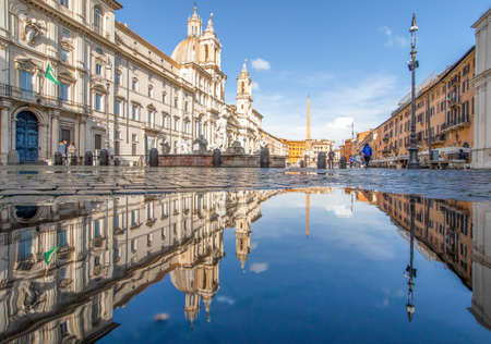 Rome, Italy - in Winter time, frequent rain showers create pools in which the wonderful Old Town of Rome reflect like in a mirror. Here in particular Piazza Navonaのeditorial素材