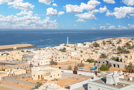 Muscat, Oman - surrounded by the green waters of the arabic sea, Oman displays dozens of wonderful seaside villages, many of them inhabited mostly by fishermanの写真素材