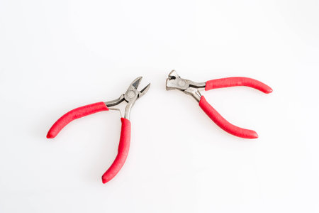 two old used Pliers on white background isolatedの写真素材
