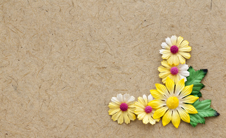 Brown natural handmade paper with yellow flowers elementの写真素材
