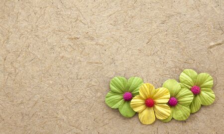 Brown natural handmade paper with paper flower elementの写真素材