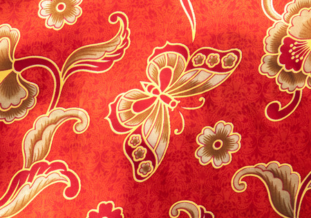 Close-up Butterfly pattern on red batikの写真素材
