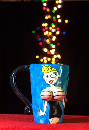Lady blue cup with colourful bokehの写真素材