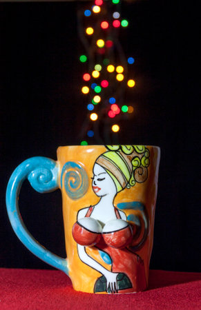 Lady cup with colourful bokehの写真素材
